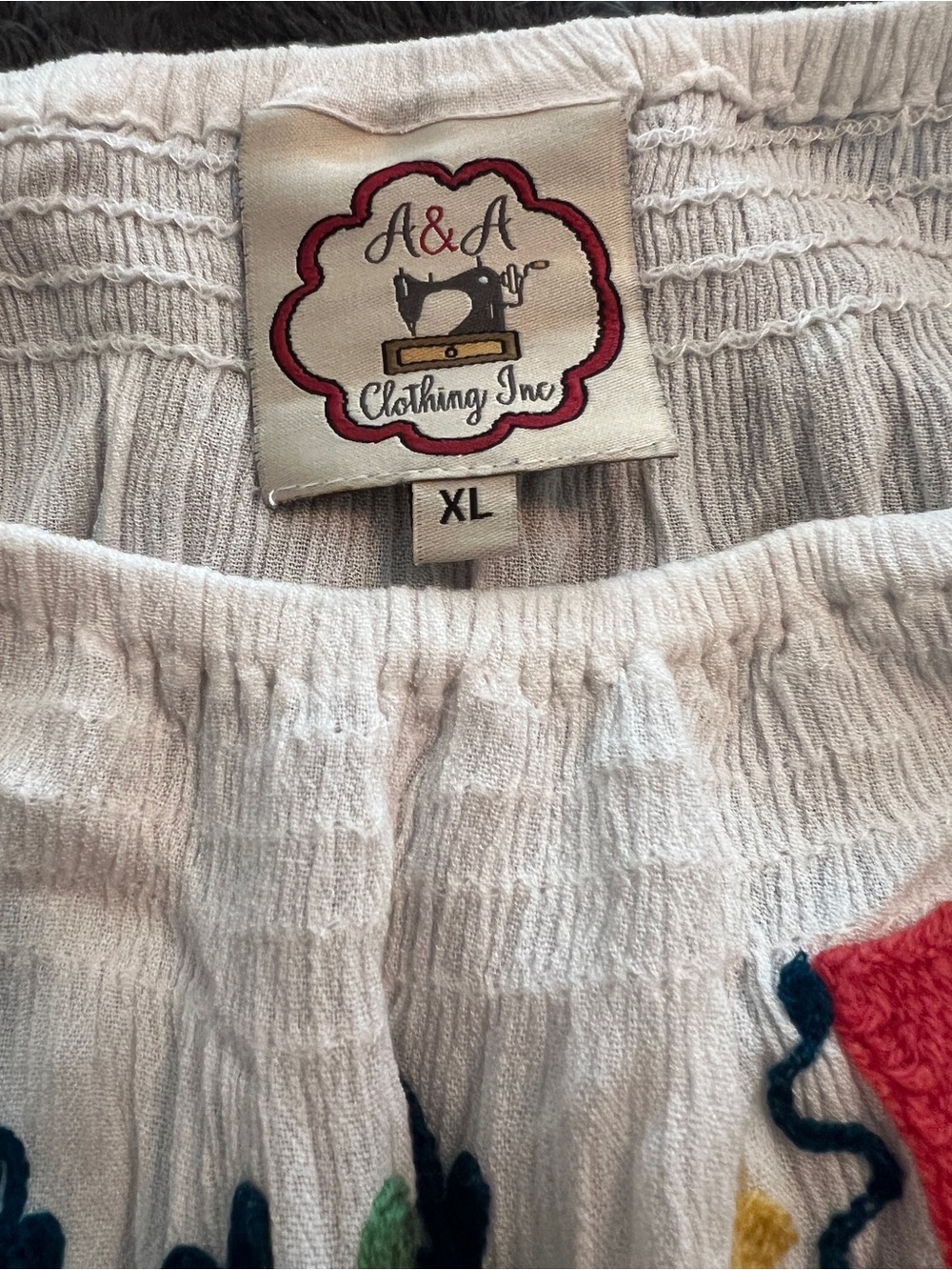White Embroidered Peasant Tunic — Pink & Multicolor Embroidered Floral Detail - Picture 4 of 4